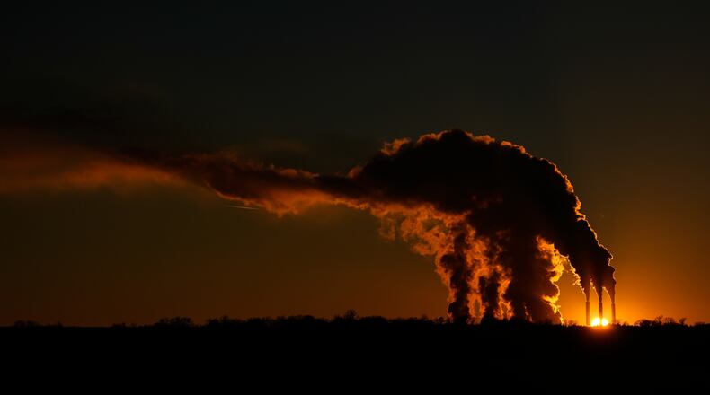 The Jeffrey Energy Center coal-fired power plant operates at sunset near Emmett, Kan., Saturday, Jan. 3, 2026, in Topeka, Kan. (AP Photo/Charlie Riedel)