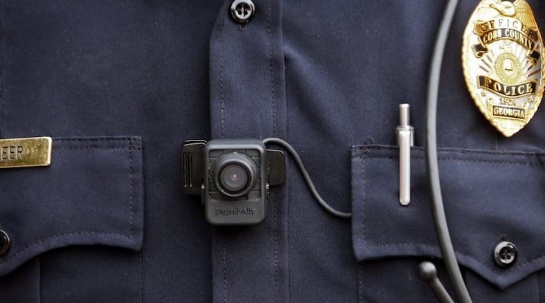 More than a year after body cameras became the widely embraced answer to the rupture in police-community relations, Gwinnett is looking into purchasing them. BOB ANDRES /BANDRES@AJC.COM