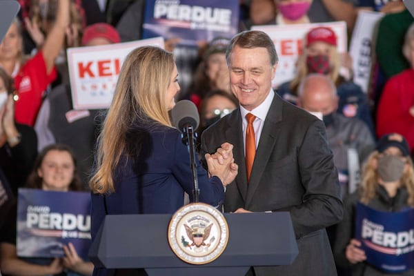 11/20/2020 -  Gainesville, Georgia  U.S. Senator Kelly Loeffler (left) and Senator David Perdue (right) embrace one another while giving remarks to a crowd gathered at a Defend the Majority Republican Rally in Gainesville, Ga., Friday, November 20, 2020.  (Alyssa Pointer / Alyssa.Pointer@ajc.com)
