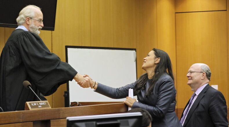 Attorney Charles Huddleston (right) and Meria Carstarphen, superintendent of Atlanta Public Schools, thank Judge Alan Harvey after his Nov. 3 ruling to allow Fulton County to collect tax money. The decision allowed APS to begin receiving long-delayed tax revenue. BOB ANDRES /BANDRES@AJC.COM
