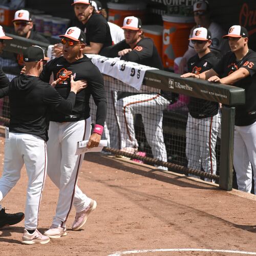 Baltimore Orioles' infield coach Miguel Cairo, center, argues after being ejected from a baseball game against the Athletics, Sunday, May 10, 2026, in Baltimore. (AP Photo/Steve Ruark)