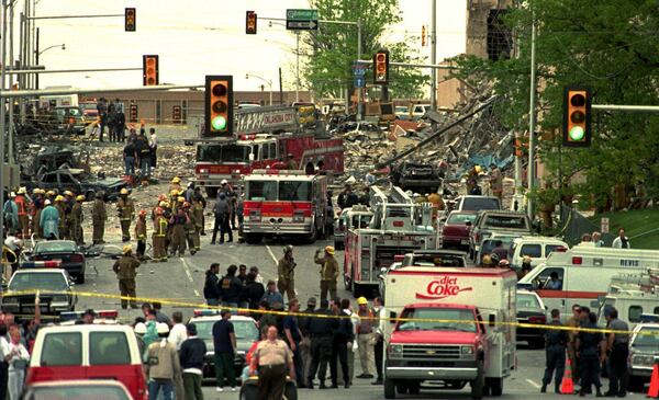 FILE - The streets surrounding the Alfred P. Murrah Federal Building in Oklahoma City are swamped with emergency vehicles and personnel on April 20, 1995, after a bomb tore through the building. (AP Photo/David J. Phillip, File)
