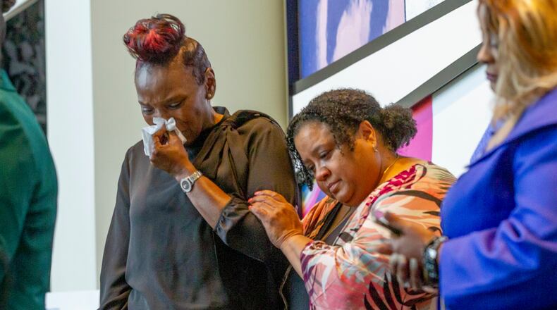 Wanda Cooper-Jones (L), the mother of the late Ahmaud Arbery, becomes emotional during an event in honor of her son at the National Center for Civil and Human Rights Wednesday, February 23, 2022. STEVE SCHAEFER FOR THE ATLANTA JOURNAL-CONSTITUTION