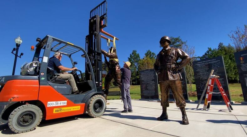 Workers installed four statues to the Korean War Memorial at the National Infantry Museum in Columbus, Georgia. The statues, sculpted by Jay Warren, depict soldiers of the Korean War and honor those who served.