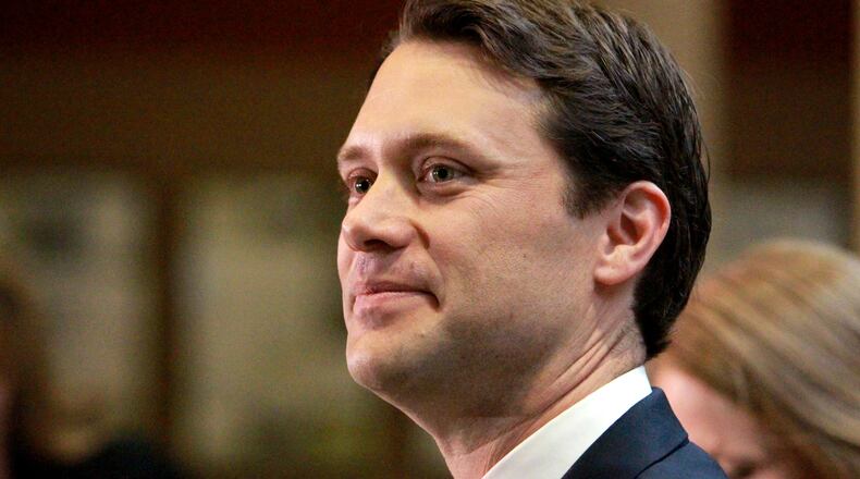 Sen. Jason Carter, D-Decatur, talks to members of the media after filing his formal candidacy papers to run for governor at the State Ethics Commission in Atlanta on Nov. 7, 2013. Carter announced today that he will run for governor in Georgia in the 2014 governor's race.