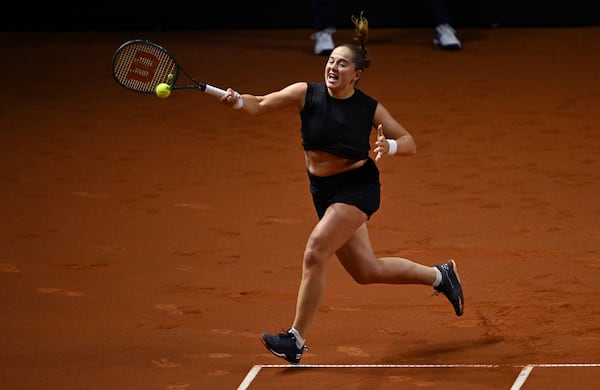 Jelena Ostapenko of Latvia in action against Aryna Sabalenka of Belarus during the women's singles final tennis match of the WTA tour, in Stuttgart, Germany, Moday, April 21, 2025. (Marijan Murat/dpa via AP)