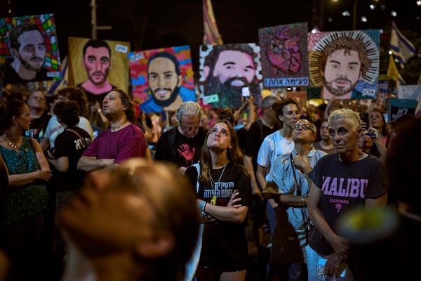 Relatives and supporters of Israeli hostages held in the Gaza Strip attend a rally demanding their release from Hamas captivity and calling for an end to the war, in Tel Aviv, Israel, Saturday, July 12, 2025. (AP Photo/Oded Balilty)