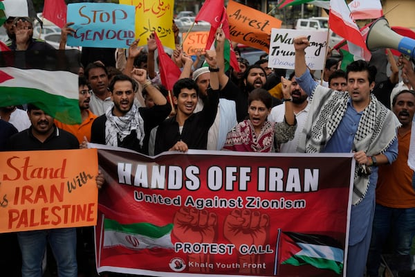 Members of a civil society group hold a demonstration to condemn Israeli strikes on Iran in Lahore, Pakistan, Sunday, June 22, 2025. (AP Photo/K.M. Chaudary)