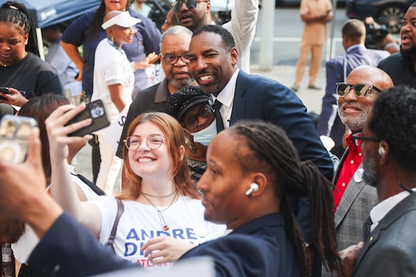 Mayor Andre Dickens takes photos with supporters after a news conference outside of Atlanta's City Hall on Tuesday, Aug. 19, 2025. After submitting qualifying paperwork to the city clerk’s office, Dickens joins a long line of Atlanta mayors who have sought a second term. (Abbey Cutrer/AJC)