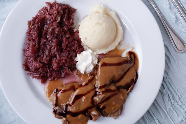 The glaze poured on top of the sauerbraten at Gasthaus Tirol is a reduced balsamic vinegar that moistens the beef with a touch of sweetness. (Natrice Miller/AJC)