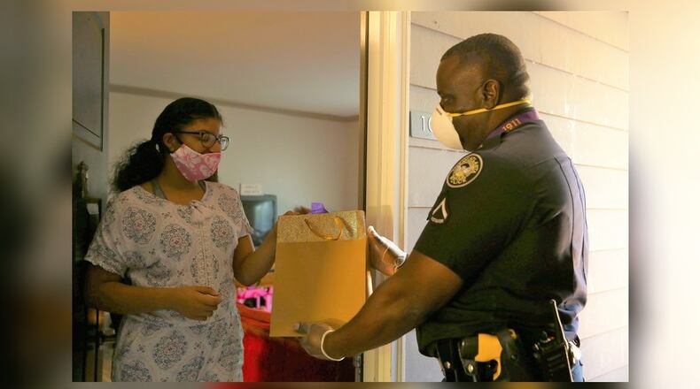 Atlanta police Inv. Keith Backmon donates Amazon Fire tablets to students. (Credit: Atlanta Police Department).