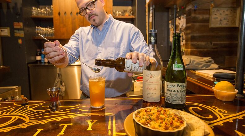 Greg Best mixes cider, brandy, bitters and tops the cocktail with sherry to create an Old Brick Wall at Ticonderoga Club in Krog Street Market. (Jenni Girtman / Atlanta Event Photography)