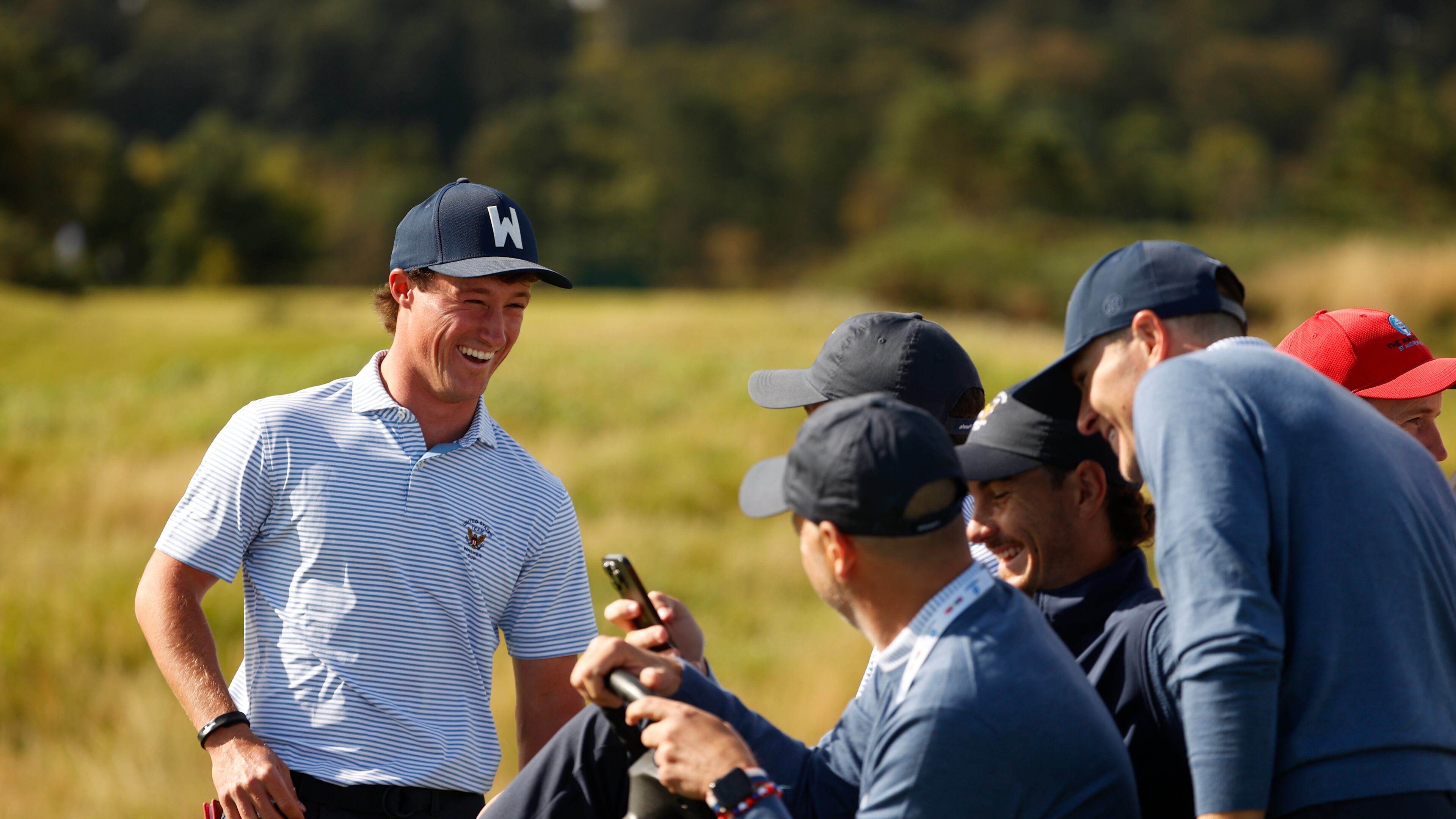 David Ford smiles while watching a video with teammates during a practice round ahead of the 2023 Walker Cup at the Old Course in St. Andrews, Scotland on Thursday, Aug. 31, 2023. (Chris Keane/USGA)