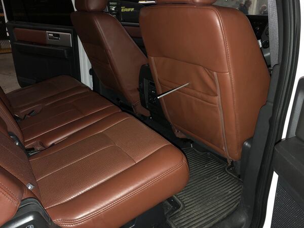 4/16/18 - Atlanta - The interior of McIvers’ Ford Expedition, where the shooting took place, with a wooden dowel tracing the path of the bullet, in the basement of the courthouse after the jury had a chance to look at it during the Tex McIver murder trial at the Fulton County Courthouse on Thursday, April 12, 2018. PHOTO COURTESY OF THE FULTON COUNTY SHERIFF’S DEPARTMENT