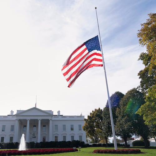 The American flag is seen at half-staff, Tuesday, Nov. 4, 2025, at the White House in Washington. (AP Photo/Manuel Balce Ceneta)
