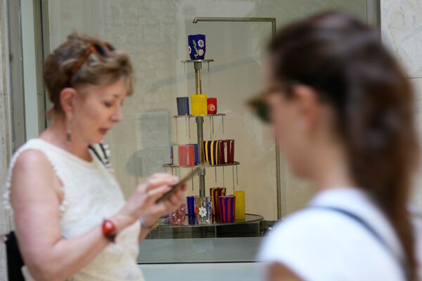 Art glasses are displayed in a shop window of Laguna B glassmaker in Venice, Italy, Thursday, June 12, 2025. (AP Photo/Luca Bruno)