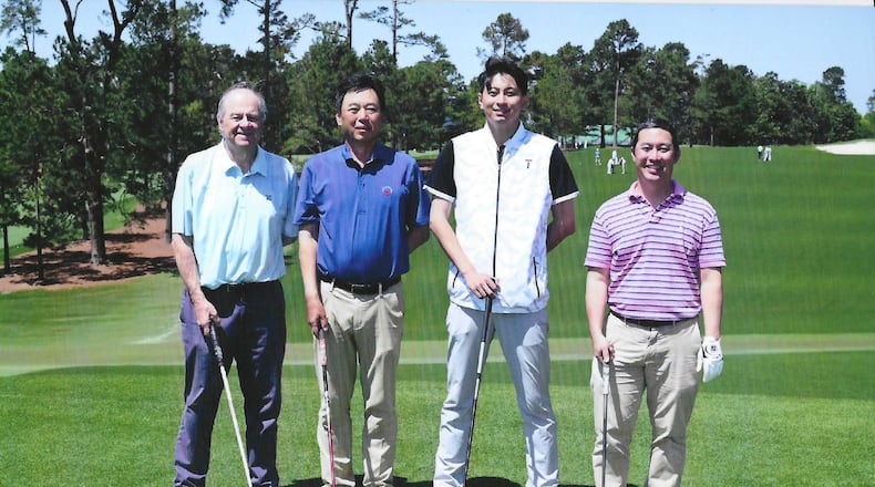 Stan Awtrey (far left) and Ken Sugiura (far right) of The Atlanta Journal-Constitution flank Chinese journalists Dening Chen (left center)and Mark Zhang. The foursome played a round of golf on the famed Augusta National course in Augusta, Ga., on Monday, April 14, 2025, the day after the conclusion of the 2025 Masters. (Photo courtesy of Augusta National Golf Club)