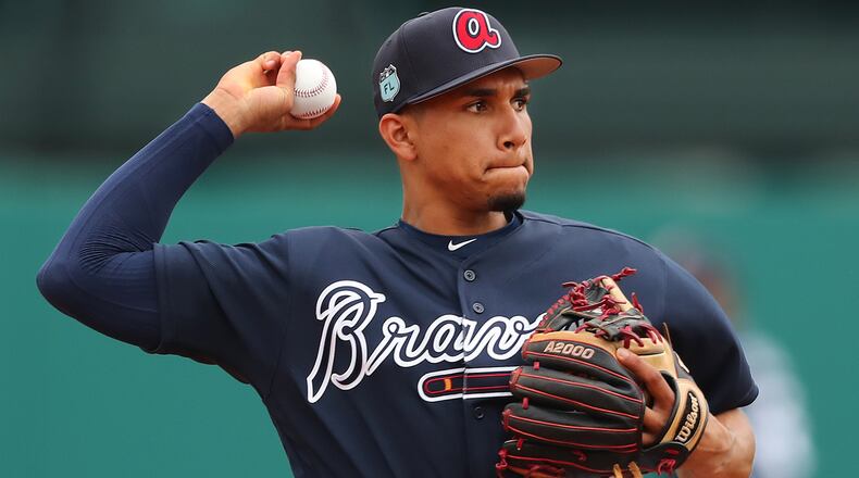 Atlanta Braves infielder Johan Camargo throws to first during the first full squad workout at Champion Stadium on Saturday Feb. 18, 2017, at the ESPN Wide World of Sports in Lake Buena Vista. Curtis Compton/ccompton@ajc.com
