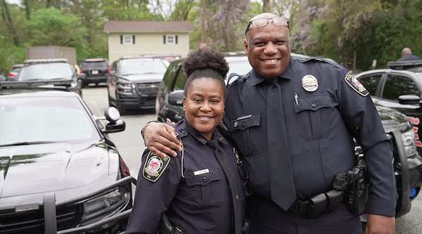 All Cops Ain't Bad is on a mission to better relationships between police officers and civilians. The nonprofit was founded by Daryll Triplett (right). Also pictured is T. Anthony (left). (Courtesy of All Cops Ain't Bad).