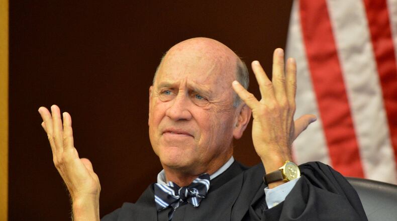 Fulton County Superior Court Judge Jerry Baxter presides over a status hearing Friday in the trial of 34 former Atlanta educators accused of participating in the nation’s largest cheating scandal.