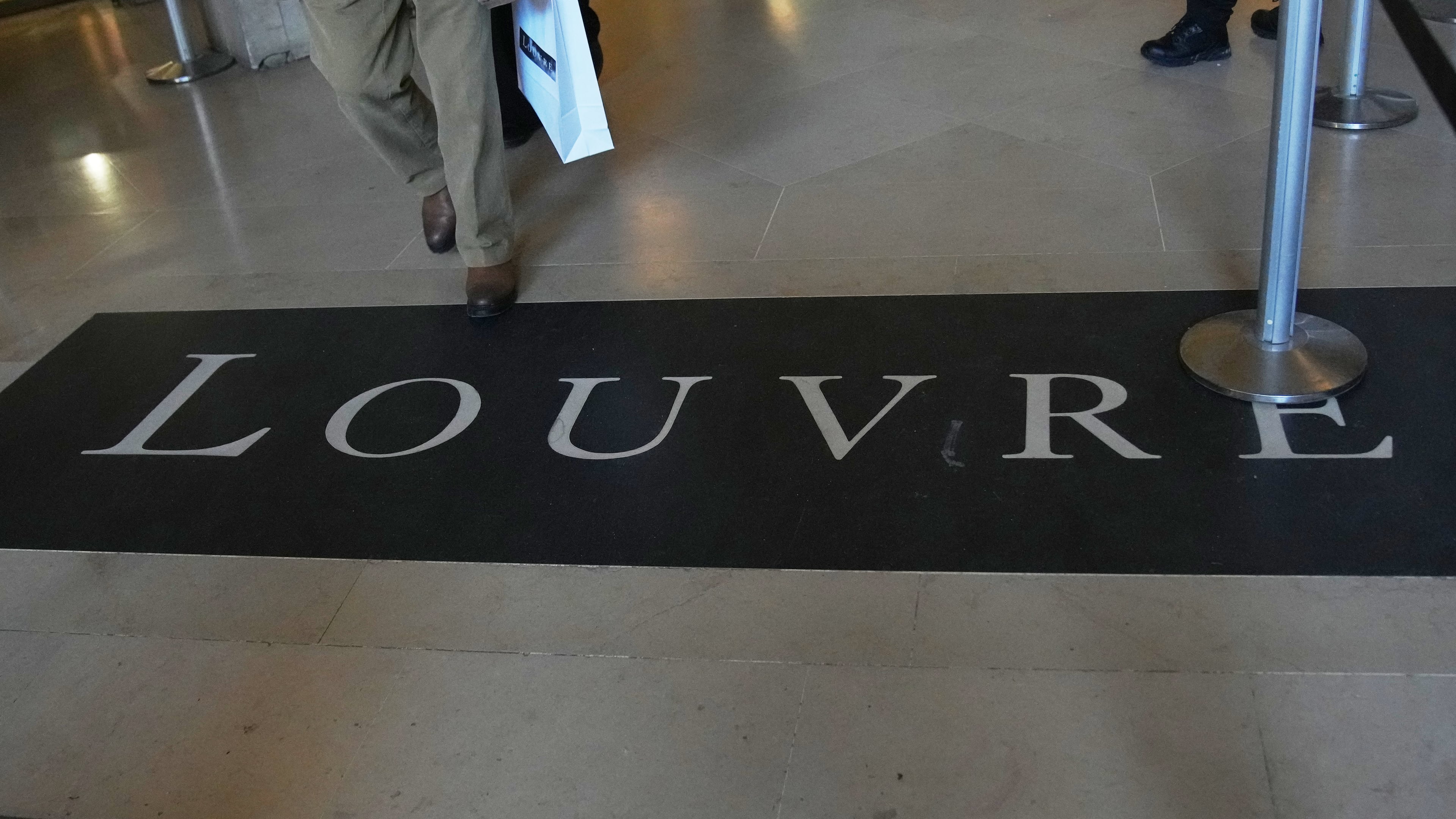FILE - A carpet at Le Louvre museum, Wednesday, Nov. 19, 2025 in Paris. (AP Photo/Christophe Ena, File)