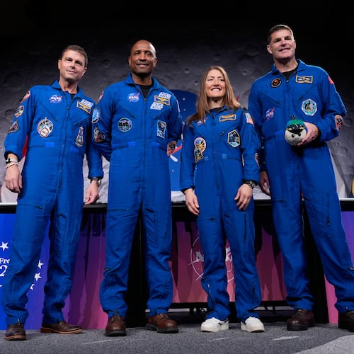 NASA's Artemis II crew - NASA astronauts Reid Wiseman, Victor Glover, and Christina Koch, and Canadian Space Agency (CSA) astronaut Jeremy Hansen pose for a photo during a press conference on Thursday, April 16, 2026, in Houston. (AP Photo/Ashley Landis)