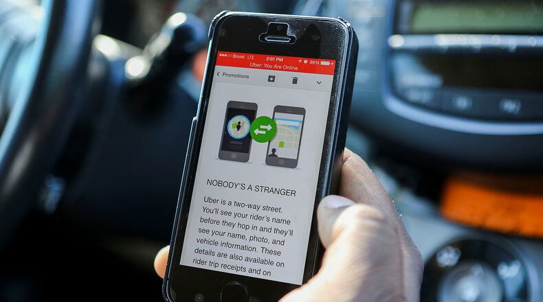 The Uber app on a driver's phone that connects him with people seeking rides. (Damon Higgins / The Palm Beach Post)