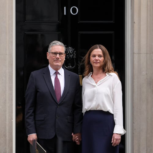 Britain's Prime Minister Keir Starmer and wife Victoria stand in front of 10 Downing Street door after speaking to the media in London, Monday, June 22, 2026.(AP Photo/Kin Cheung)