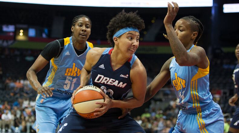 Atlanta Dream guard Layshia Clarendon (23) drives the ball to the basket while being defended by Chicago Sky guard Jamierra Faulkner (21), right, and Chicago Sky forward Jessica Breland (51) during a game between the Atlanta Dream and Chicago Sky at Phillips Arena, Sunday, May 22, 2016, in Atlanta. The Atlanta Dream defeated Chicago Sky 87-81. BRANDEN CAMP/SPECIAL