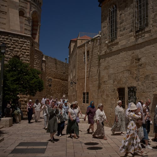 Christian pilgrims visit the Cenacle, traditionally believed to be the site of the Last Supper, in Jerusalem, Friday, May 1, 2026, as they walk past the site where a nun was attacked by a man last Wednesday. (AP Photo/Leo Correa)