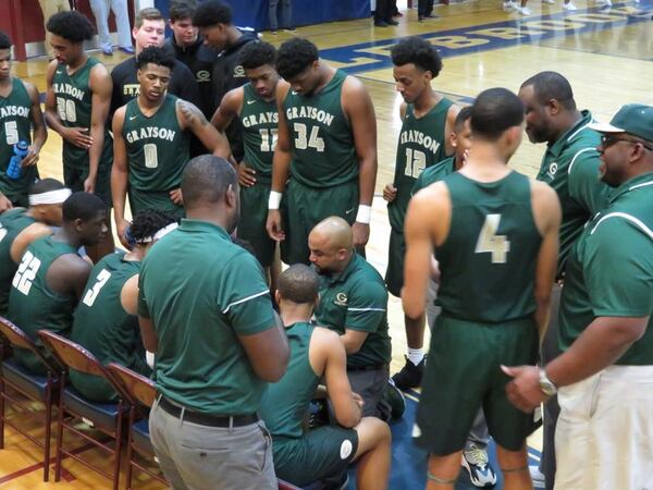 The Grayson Rams, led by coach Geoffrey Pierce (center, kneeling) are ranked No. 1 in AAAAAAA and will play in the Flyin' To The Hoop Invitational in Dayton, Ohio, and the Kevin Durant MLK Classic in Washington D.C. over the Martin Luther King holiday. (File photo)