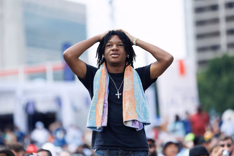 A FIFA Fan Fest attendee reacts to a play by Argentina while watching the World Cup game against Egypt on a screen at Centennial Park on Tuesday, July 7, 2026, in Atlanta. Argentina won 3-2. (Estela Muñoz/AJC)