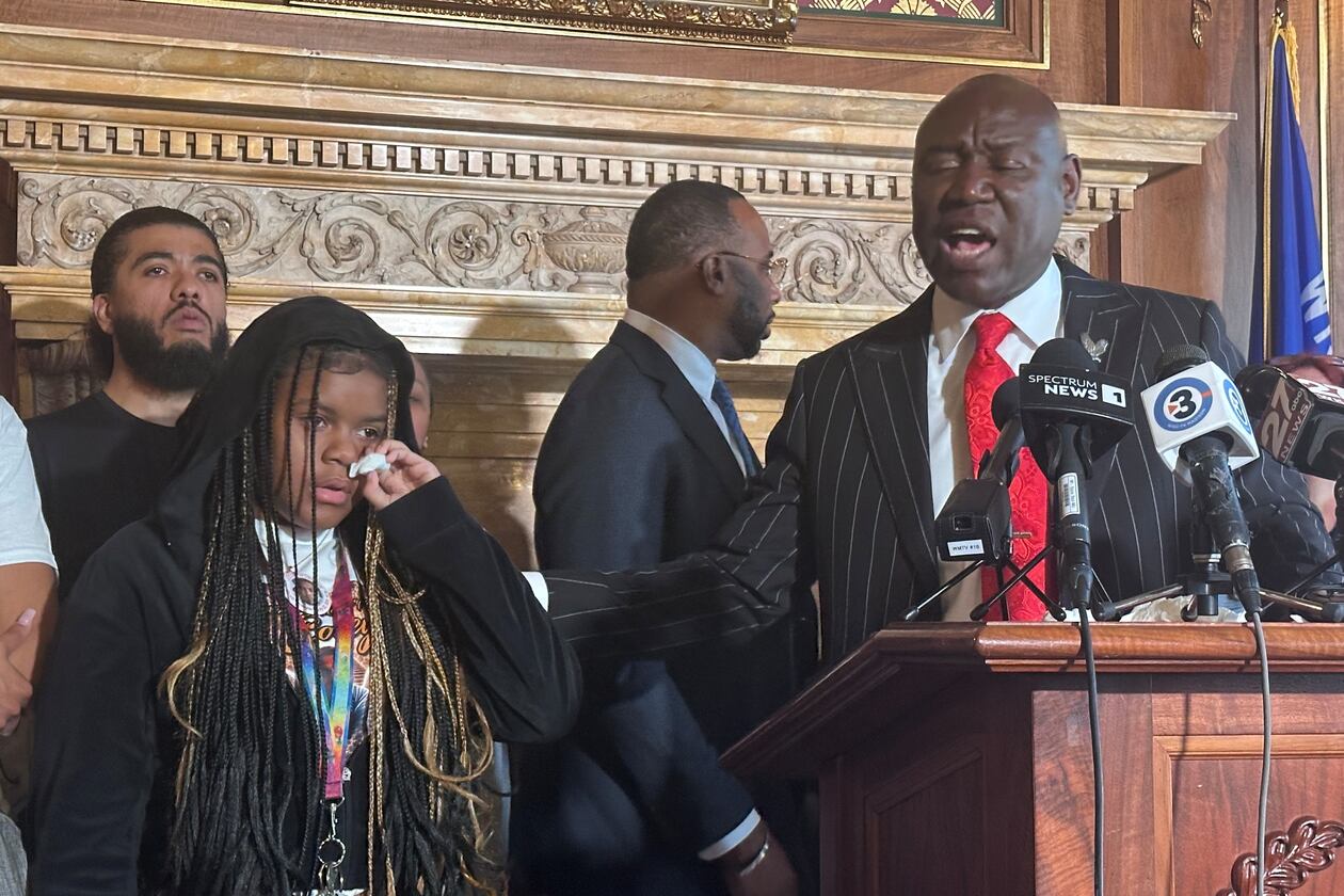 Kah'liyah Aliomar, the daughter of Corey Ruiz, who was shot and killed by a Madison police officer, wipes away tears as attorney Ben Crump speaks at a news conference on Friday, July 24, 2026, in Madison, Wis. (AP Photo/Scott Bauer)