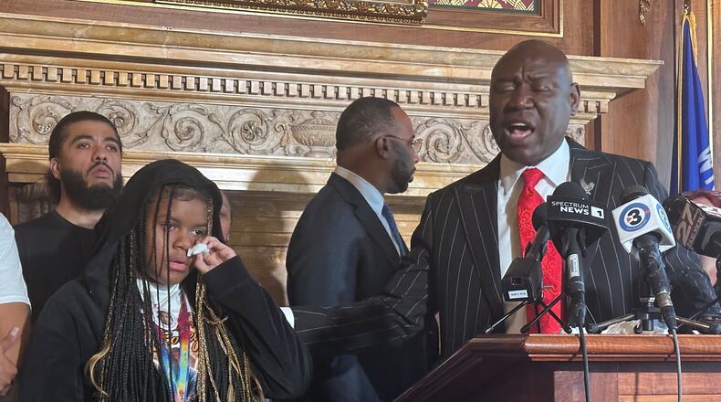 Kah'liyah Aliomar, the daughter of Corey Ruiz, who was shot and killed by a Madison police officer, wipes away tears as attorney Ben Crump speaks at a news conference on Friday, July 24, 2026, in Madison, Wis. (AP Photo/Scott Bauer)