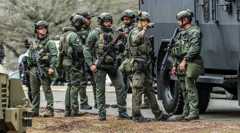 January 18, 2023 ATLANTA: DeKalb and Atlanta SWAT members leaving from Gresham Park command post. Georgia state troopers helping conduct a Òclearing operationÓ at the site of AtlantaÕs planned public safety training center exchanged gunfire with a protester Wednesday morning, Jan. 18, 2023 leaving the protester dead and one trooper wounded, according to the Georgia Bureau of Investigation. The purported protester, who was accused of firing first, was believed to be a male. His identity was not immediately released. The wounded trooper also was not identified. He was in surgery around lunchtime Wednesday and in stable condition, Georgia State Patrol Col. Chris Wright said during a brief press conference outside Grady Memorial Hospital. Few other details about the incident near Constitution Road, just south of the proposed training center site in southwestern DeKalb, have been released. Law enforcement was out en masse at nearby Gresham Park and along Key Road to the north. (John Spink / John.Spink@ajc.com)
