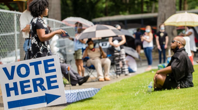 Voters wait in long lines, at times in the rain, at New Beginnings Full Gospel Church on Tuesday, June 9, 2020. The lines were taking more than 3.5 hours. This polling location opened at 7 am with only one machine of the four available working and had two of the four working at 4:30 and were not providing provisional ballots. (Jenni Girtman for The Atlanta Journal-Constitution)