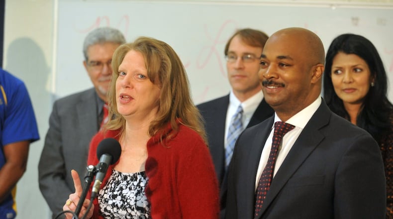 Kwanza Hall, right, authored legislation that eliminates a question about criminal records from the city of Atlanta’s job application. Atlanta Councilperson Carla Smith is on the left.