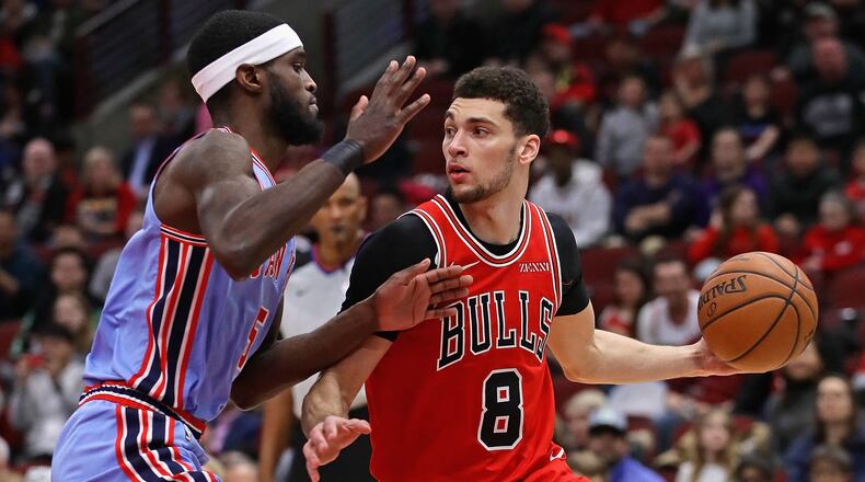 Zach LaVine of the Chicago Bulls moves against B.J.Johnson of the Atlanta Hawks at the United Center on March 03, 2019 in Chicago, Illinois.