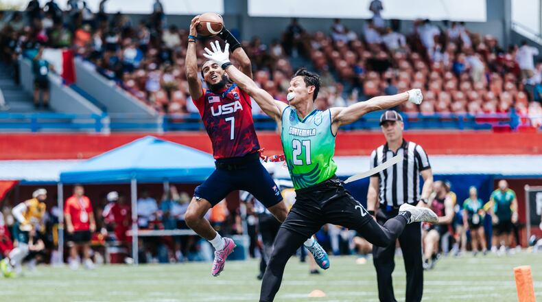 This photo provided by USA Football shows quarterback Darrell “Housh” Doucette III, left, in Panama in September 2025. (Lester Barnes/USA Football via AP)