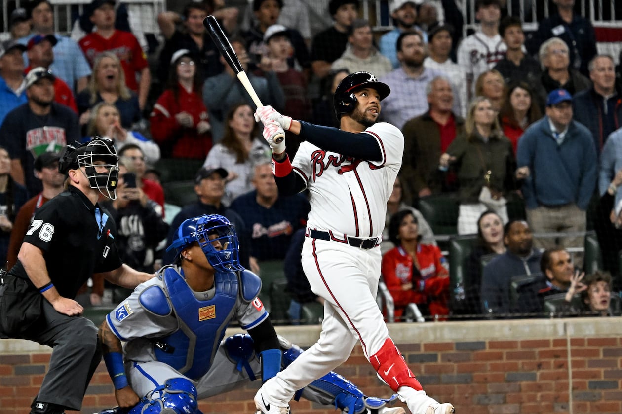 The Braves' Dominic Smith hits a grand slam in the ninth inning to give Atlanta a 6-2 win over the Kansas City Royals on Saturday, March 28, 2026, at Truist Park in Atlanta. (Hyosub Shin/AJC)