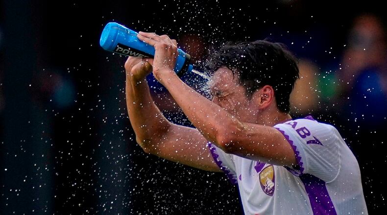 FILE - Al Ain's Park Yong-woo cools off during the Club World Cup Group G soccer match between Wydad AC and Al Ain FC in Washington, June 26, 2025. (AP Photo/Julia Demaree Nikhinson, File)
