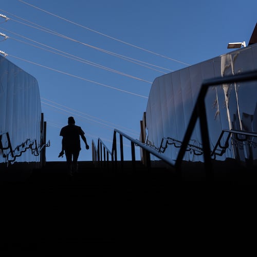 Quantavia Smith walks up the steps of a metro station next to the Santa Monica and Vermont Apartments, where she lives, in Los Angeles, Monday, Nov. 10, 2025. (AP Photo/Jae C. Hong)