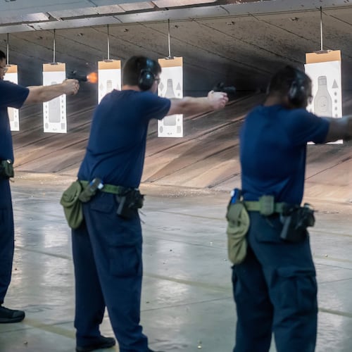 FILE - Immigration and Customs Enforcement (ICE) trainees practice shooting handguns at the indoor firing range at the Federal Law Enforcement Training Centers (FLETC) in Brunswick, Ga., Aug. 21, 2025. (AP Photo/Fran Ruchalski, File)