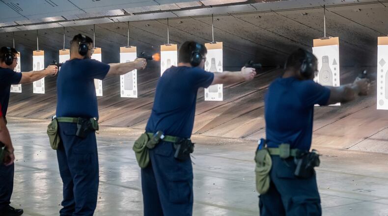 FILE - Immigration and Customs Enforcement (ICE) trainees practice shooting handguns at the indoor firing range at the Federal Law Enforcement Training Centers (FLETC) in Brunswick, Ga., Aug. 21, 2025. (AP Photo/Fran Ruchalski, File)