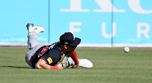 Braves outfielder Jarred Kelenic loses a ball hit by a Rays player. 