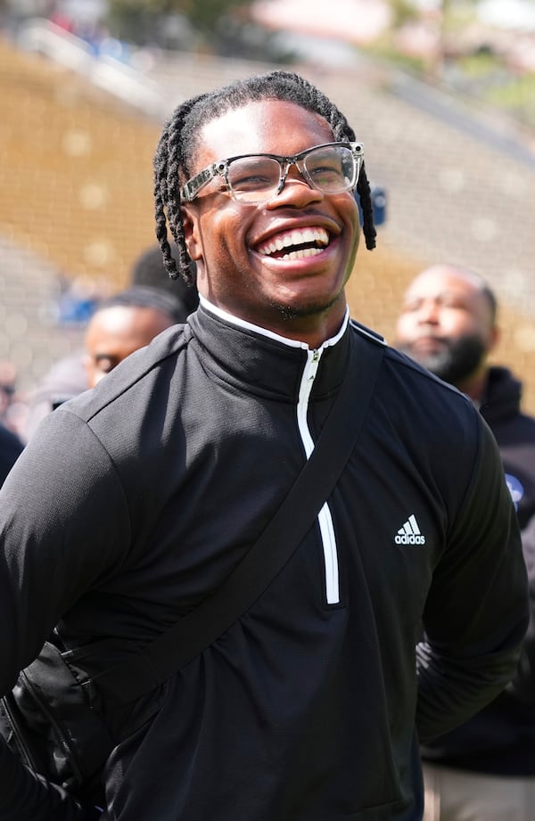 Travis Hunter reacts to his jersey retirement during Colorado's NCAA college football spring game, Saturday, April 19, 2025, in Boulder, Colo. (AP Photo/Jack Dempsey)