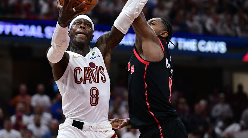 Cleveland Cavaliers guard Dennis Schroder goes to the basket against Toronto Raptors forward RJ Barrett during the second half in Game 5 of a first-round NBA playoffs basketball series, Wednesday, April 29, 2026, In Cleveland. (AP Photo/David Dermer)