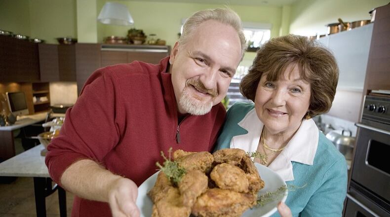 “Fried chicken takes no sides,” says restaurateur Art Smith of Southern Art and Bourbon Bar in Buckhead. “Just as many Republicans have eaten my food as Democrats.” Smith will be the personal chef to Michelle Obama for her author appearance in Atlanta on May 11 at State Farm Arena. He will also be at his Buckhead restaurant for Mother’s Day brunch May 12. Here, he is pictured with his mother, Addie Mae Smith. CONTRIBUTED BY SOUTHERN ART AND BOURBON BAR