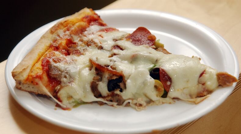 A slice of Supreme Pizza at Feliini's Pizza / AJC file photo