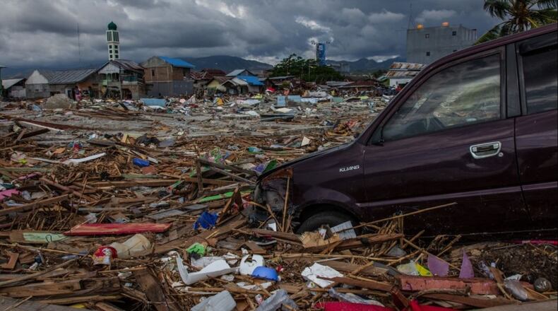 PALU, INDONESIA - OCTOBER 12: A car is seen in damaged area after being hit by tsunami in Talise following the earthquake, on October 12, 2018 in Palu, Indonesia.